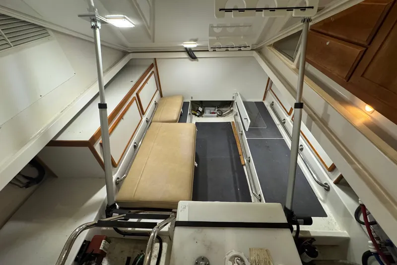 Slide: The Image of 2020 Back Cove 34O interior with seating and storage compartments. - 11