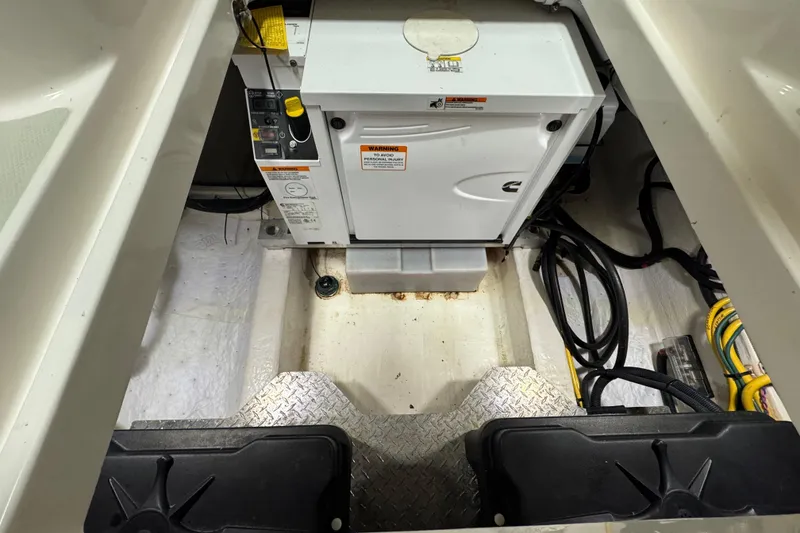 Slide: The Image of Engine compartment of 2020 Back Cove 34O boat with generator and cables. - 13