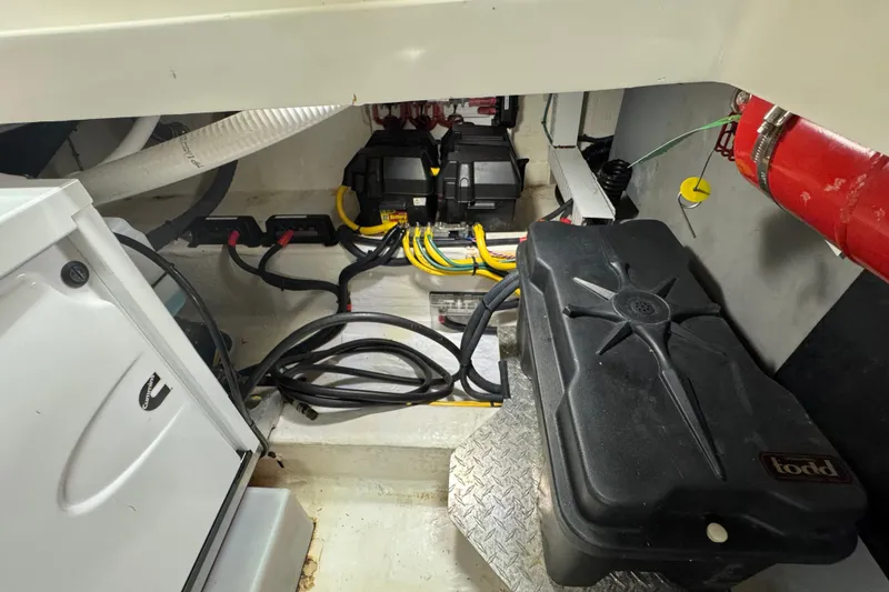 Slide: The Image of Engine compartment of 2020 Back Cove 34O boat, featuring wiring and equipment. - 14