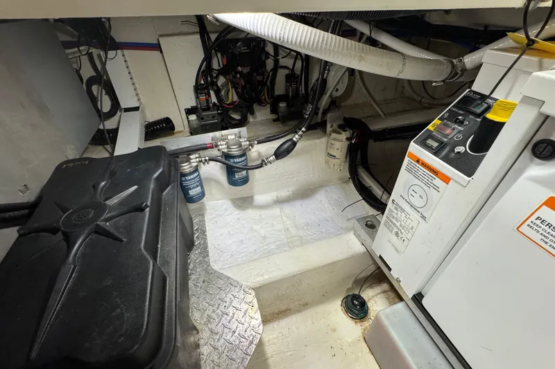 Slide: The Image of Engine room of 2020 Back Cove 34O boat, featuring Yamaha components and control panel. - 15