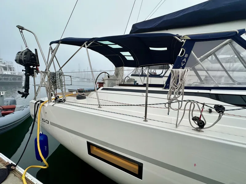 Slide: The Image of 2020 Bavaria C50 sailboat docked, featuring sleek design and modern equipment. - 10