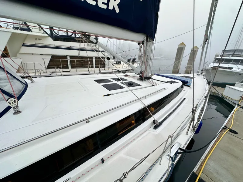 Slide: The Image of 2020 Bavaria C50 yacht docked at marina on a foggy day. - 13