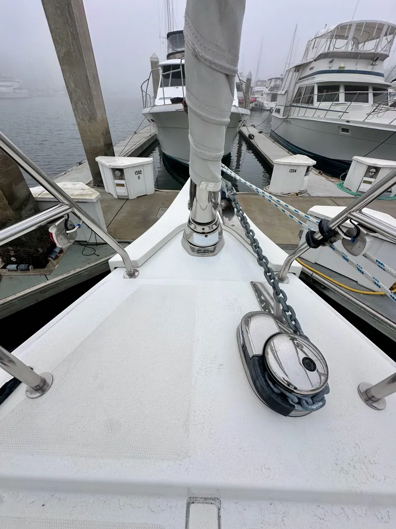 Slide: The Image of Bow of 2020 Bavaria C50 yacht docked at marina with anchor chain visible. - 17