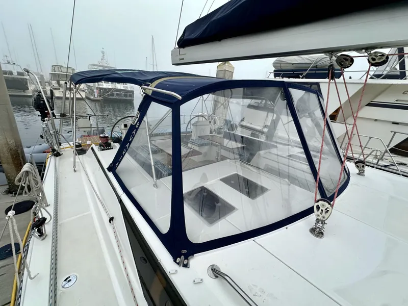 Slide: The Image of 2020 Bavaria C50 yacht with cockpit enclosure at marina. - 22