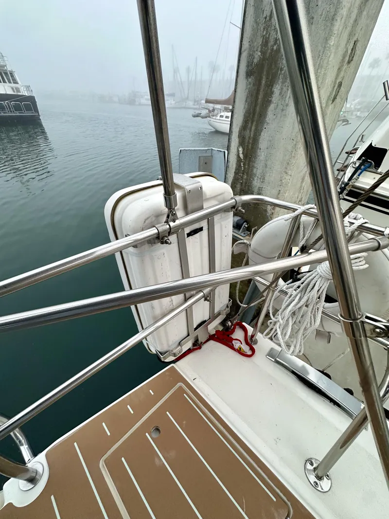 Slide: The Image of 2020 Bavaria C50 yacht deck with safety equipment and marina view. - 29