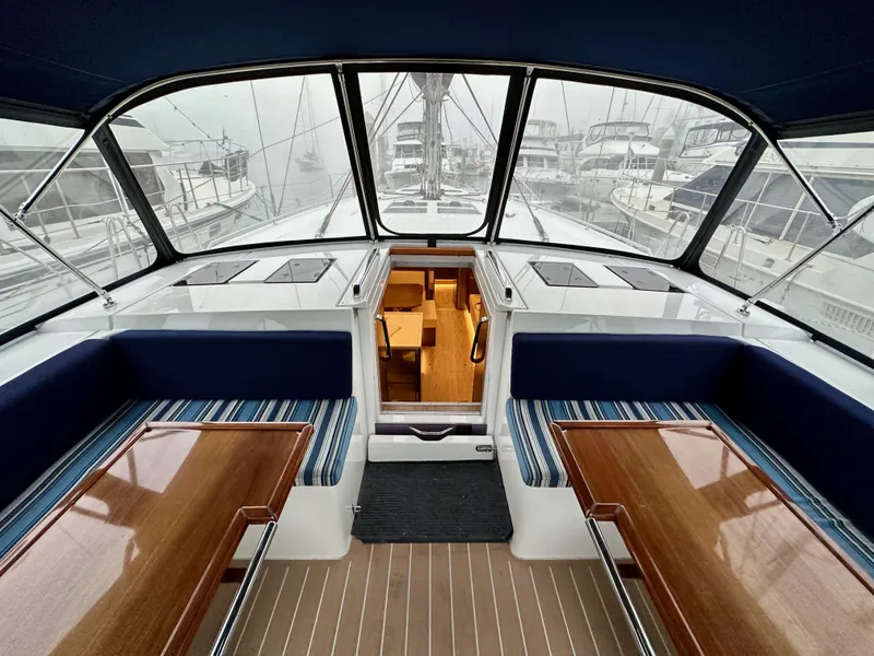 Slide: The Image of Interior view of 2020 Bavaria C50 yacht with elegant seating and wooden tables. - 39