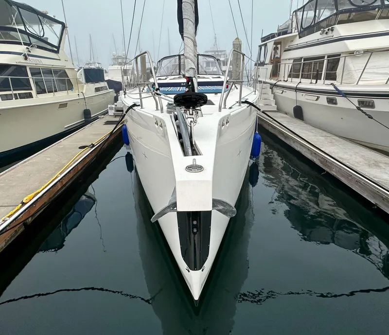 Slide: The Image of 2020 Bavaria C50 yacht docked between boats in a marina. - 4