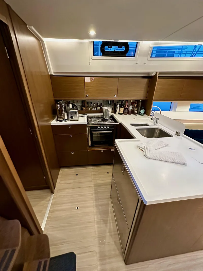 Slide: The Image of Modern kitchen interior of 2020 Bavaria C50 yacht with wooden cabinetry and appliances. - 43