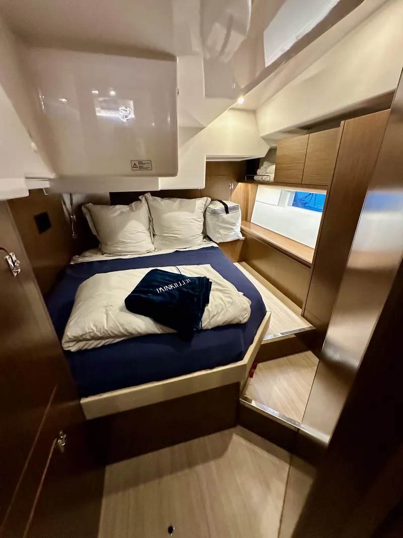 Slide: The Image of Cozy cabin interior of 2020 Bavaria C50 yacht with bed and wooden furnishings. - 46