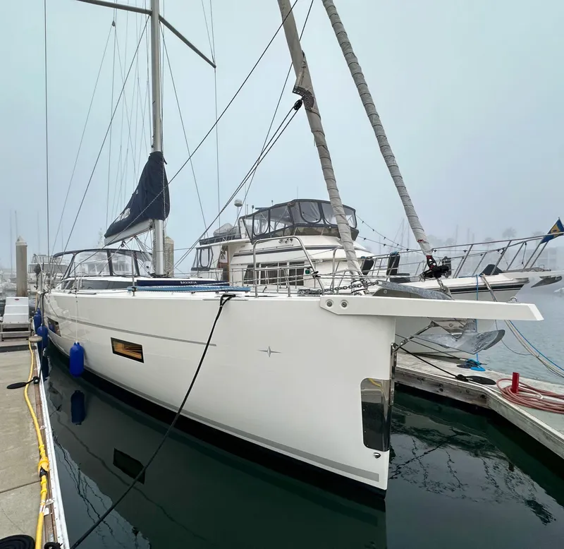 Slide: The Image of 2020 Bavaria C50 yacht docked at marina on a foggy day. - 5