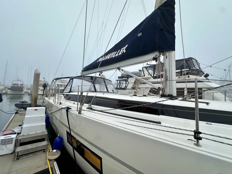 Slide: The Image of Bavaria C50 yacht docked at marina, 2020 model, with misty background. - 8