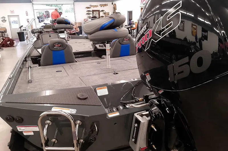Slide: The Image of 2026 Ranger RT198P boat with Mercury Pro XS 150 engine in showroom. - 11