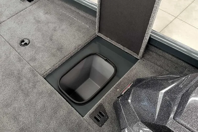 Slide: The Image of 2026 Ranger RT198P boat storage compartment with open lid, showcasing interior space. - 14