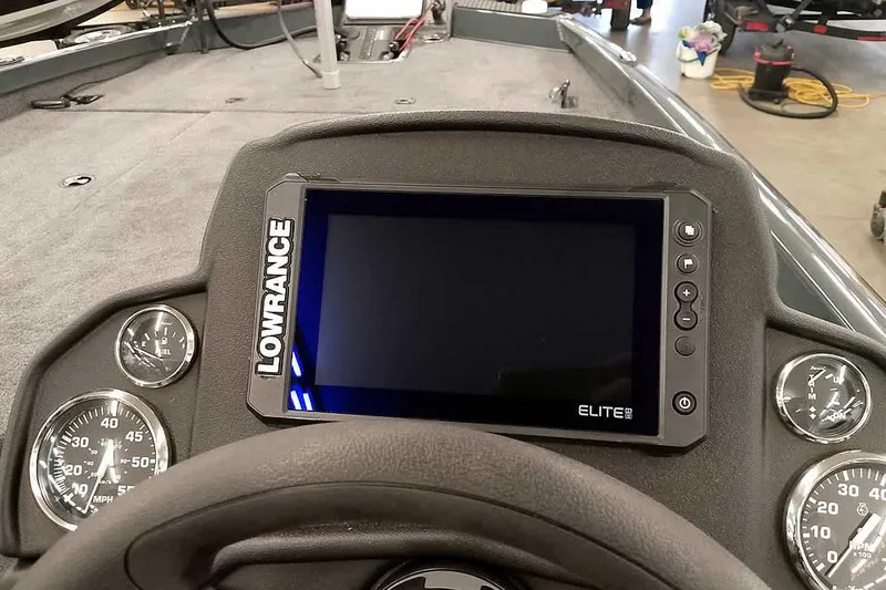 Slide: The Image of 2026 Ranger RT198P boat dashboard with Lowrance Elite display and gauges. - 26