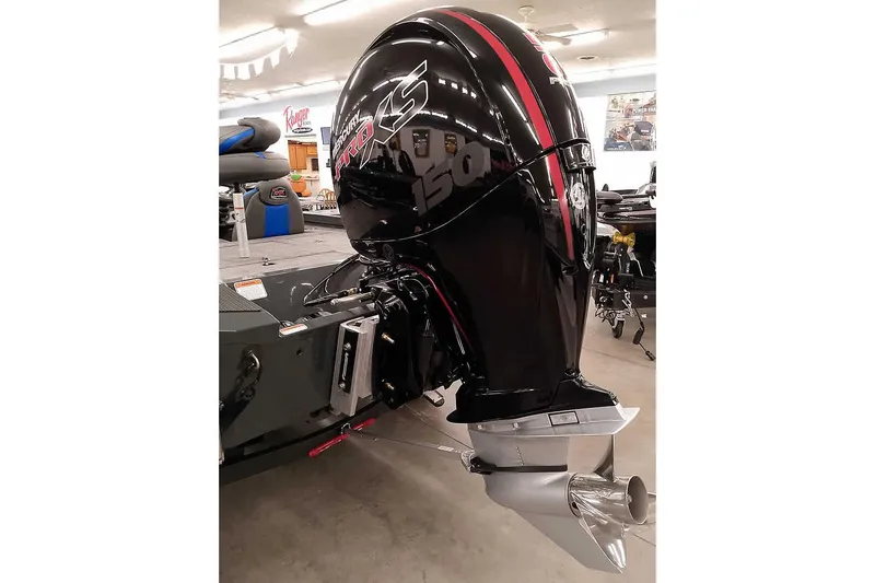 Slide: The Image of 2026 Ranger RT198P boat with powerful outboard motor in showroom setting. - 3