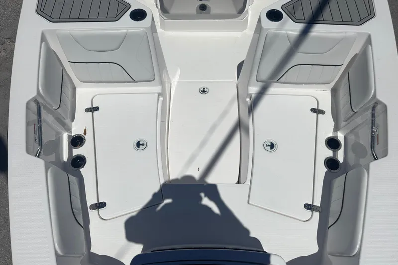 Slide: The Image of 2026 Yamaha Boats 220 FSH Sport interior, featuring seating and storage compartments. - 10