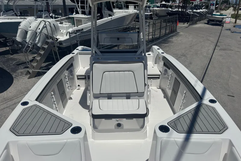 Slide: The Image of 2026 Yamaha Boats 220 FSH Sport, sleek design, spacious seating, docked outdoors. - 11