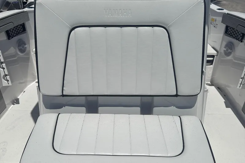 Slide: The Image of 2026 Yamaha Boats 220 FSH Sport, white cushioned seating detail. - 12
