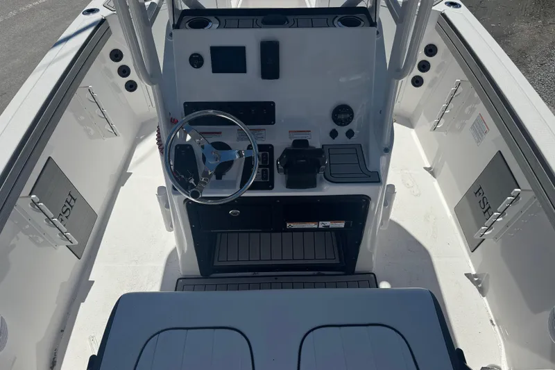 Slide: The Image of 2026 Yamaha Boats 220 FSH Sport dashboard with steering wheel and controls. - 5