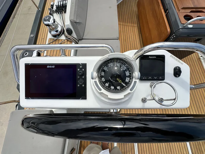 Slide: The Image of Helm of 2018 Jeanneau 54 yacht with navigation instruments and compass. - 34