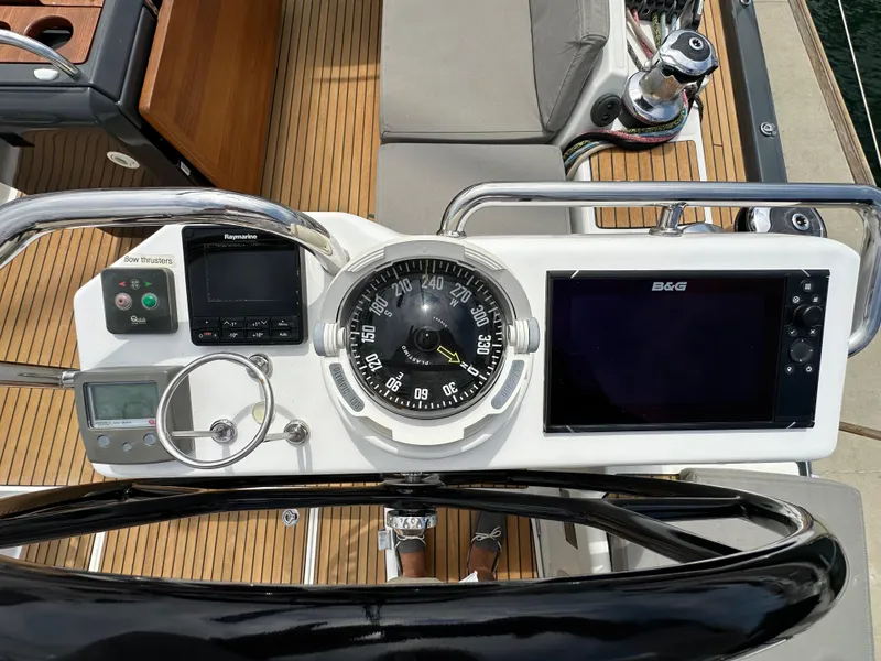 Slide: The Image of Cockpit of 2018 Jeanneau 54 sailboat with navigation instruments and compass. - 38