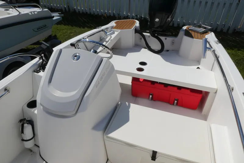 Slide: The Image of 2019 Boston Whaler 160 Super Sport interior with steering console and seating. - 5