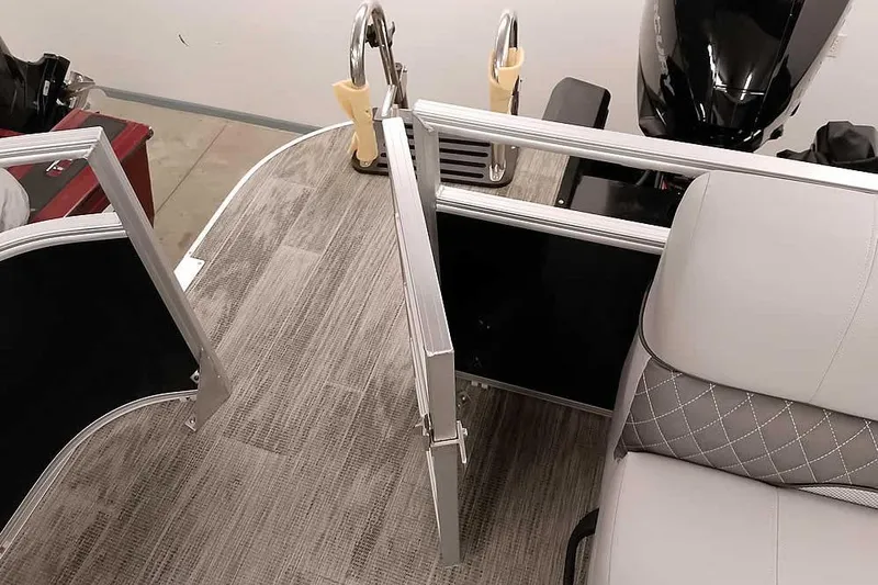 Slide: The Image of 2024 Ranger Reata 223C boat interior with open gate and seating. - 11