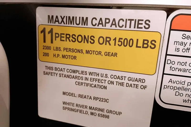 Slide: The Image of 2024 Ranger Reata 223C capacity label: 11 persons or 1500 lbs, 200 HP motor. - 13