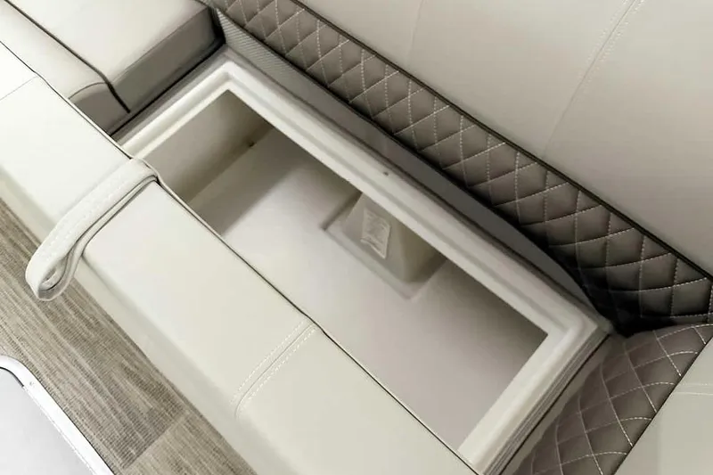 Slide: The Image of 2024 Ranger Reata 223C boat seat storage with quilted upholstery and spacious compartment. - 22
