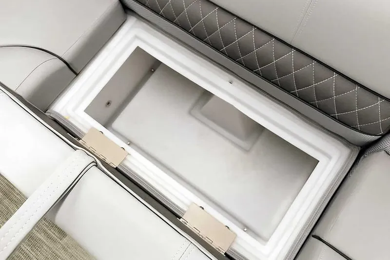 Slide: The Image of 2024 Ranger Reata 223C boat seat storage compartment with quilted upholstery. - 23