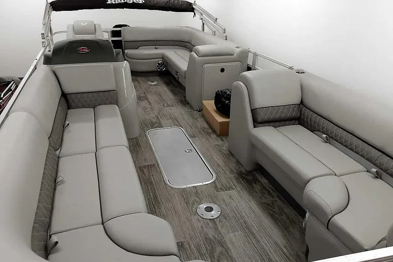 Slide: The Image of 2024 Ranger Reata 223C pontoon boat interior with spacious seating and modern design. - 7