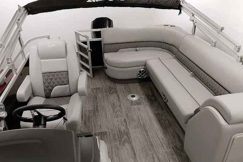 Slide: The Image of 2024 Ranger Reata 223C pontoon boat interior with luxurious seating and modern design. - 8