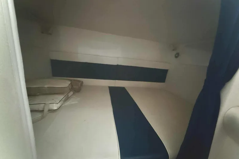 Slide: The Image of Interior cabin of 2002 Donzi Z 32 EXPRESS boat with blue and white upholstery. - 10