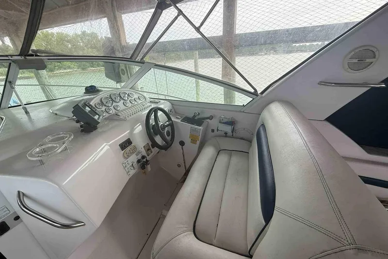 Slide: The Image of Interior of 2002 Donzi Z 32 EXPRESS boat with steering wheel and dashboard controls. - 3