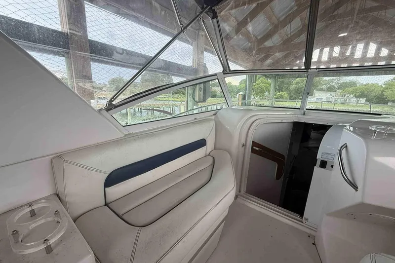 Slide: The Image of 2002 Donzi Z 32 EXPRESS boat interior with seating and cabin entrance. - 4