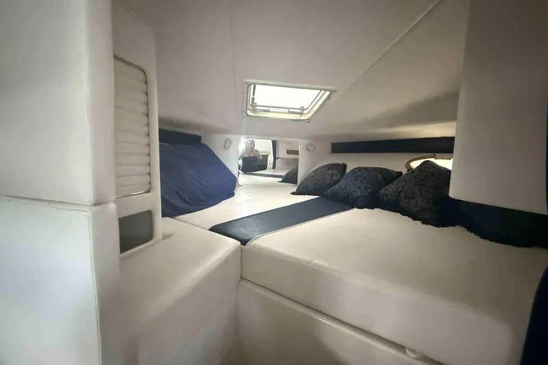 Slide: The Image of Interior cabin of 2002 Donzi Z 32 EXPRESS with cozy bedding and cushions. - 9