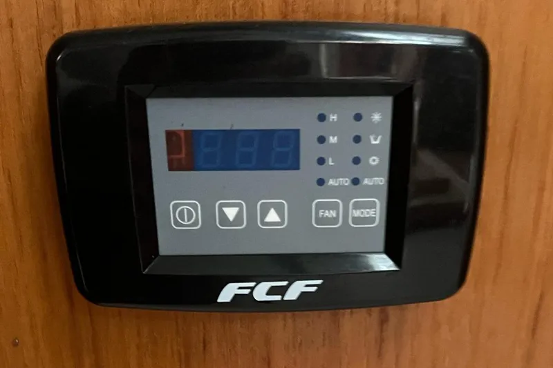 Slide: The Image of Control panel on a 1992 Catalina Sloop, displaying digital settings. - 14