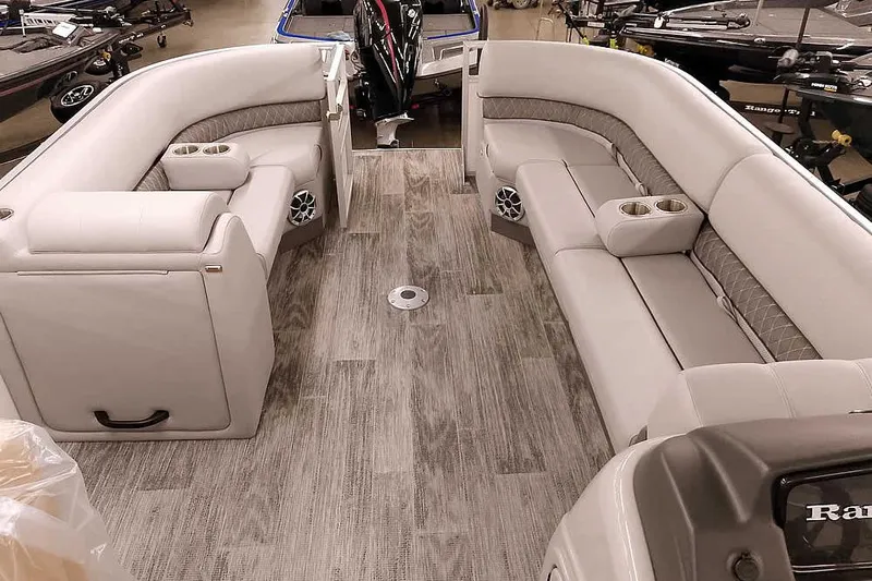 Slide: The Image of 2025 Ranger Reata 220C boat interior with plush seating and modern design. - 17