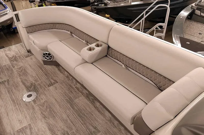 Slide: The Image of Luxurious seating on 2025 Ranger Reata 220C boat, featuring cup holders and elegant design. - 18