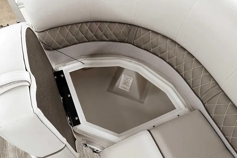 Slide: The Image of 2025 Ranger Reata 220C boat seat with storage compartment, featuring diamond-stitched upholstery. - 22