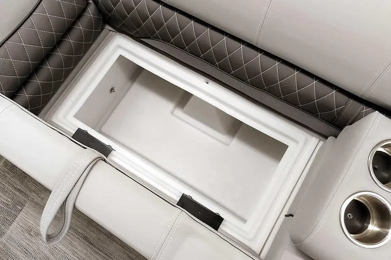 Slide: The Image of 2025 Ranger Reata 220C boat seat storage with quilted upholstery and cup holders. - 24