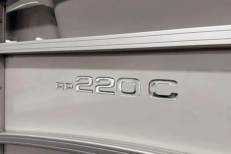Slide: The Image of 2025 Ranger Reata 220C model emblem on sleek metallic surface. - 4