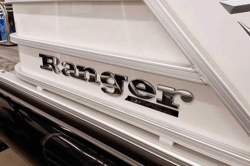 Slide: The Image of 2025 Ranger Reata 220C boat logo on sleek white exterior. - 5