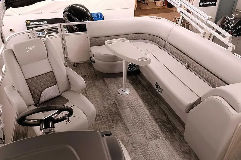 Slide: The Image of Luxurious interior of 2025 Ranger Reata 220C pontoon boat with plush seating and modern design. - 8