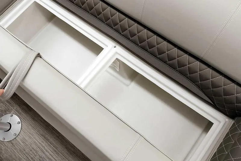 Slide: The Image of 2025 Ranger Reata 220C storage compartment with quilted upholstery and durable interior design. - 9