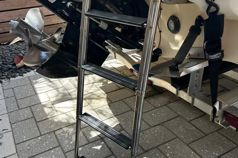 Slide: The Image of Stainless steel ladder and propeller of 2007 Sea Ray 240 Sundancer boat on a trailer. - 11