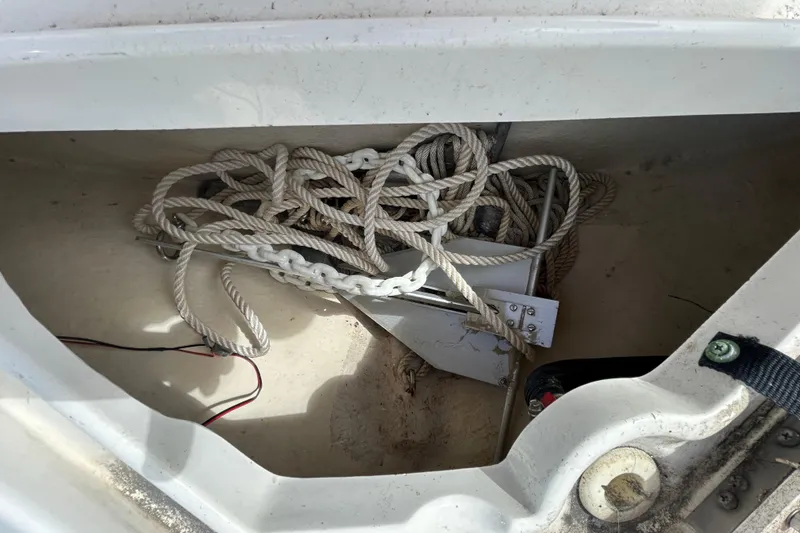 Slide: The Image of Anchor and ropes stored in a 2007 Sea Ray 240 Sundancer boat compartment. - 14
