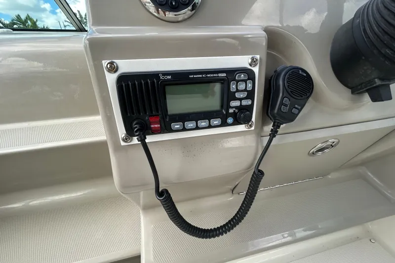 Slide: The Image of VHF radio system on 2007 Sea Ray 240 Sundancer boat dashboard. - 17