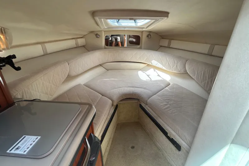 Slide: The Image of 2007 Sea Ray 240 Sundancer cabin interior with beige seating and compact design. - 27