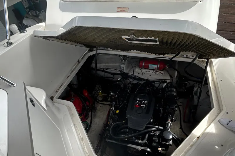 Slide: The Image of Engine compartment of a 2007 Sea Ray 240 Sundancer boat with visible fire extinguisher. - 31